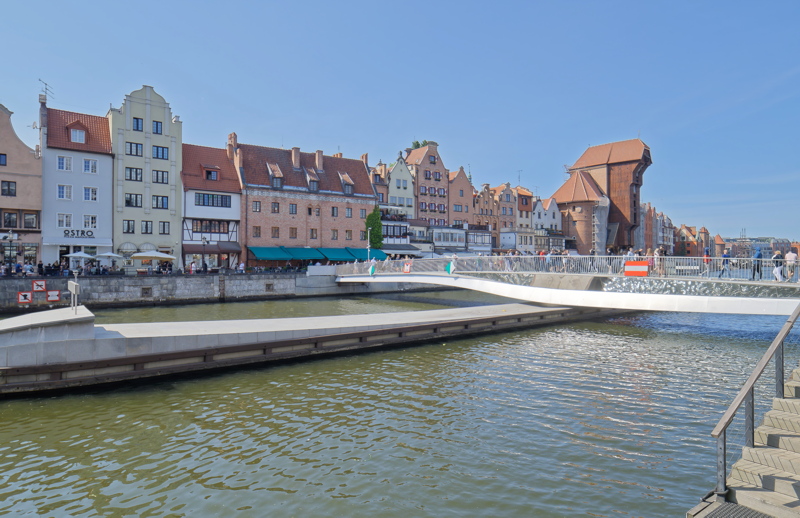 Prominent waterfront in Gdańsk, Poland, featuring modern infrastructure alongside historic architecture